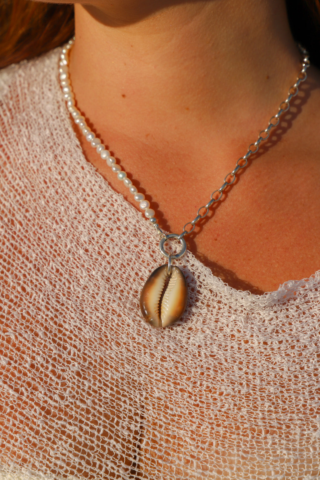 Pearl + silver charm keeper with cowrie charm