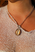Pearl + silver charm keeper with cowrie charm